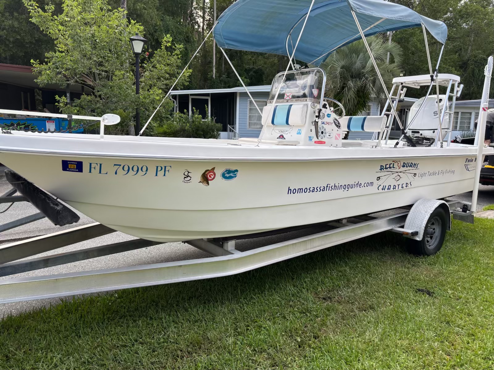 Citrus Coatz boat detailing — center console on trailer with canopy